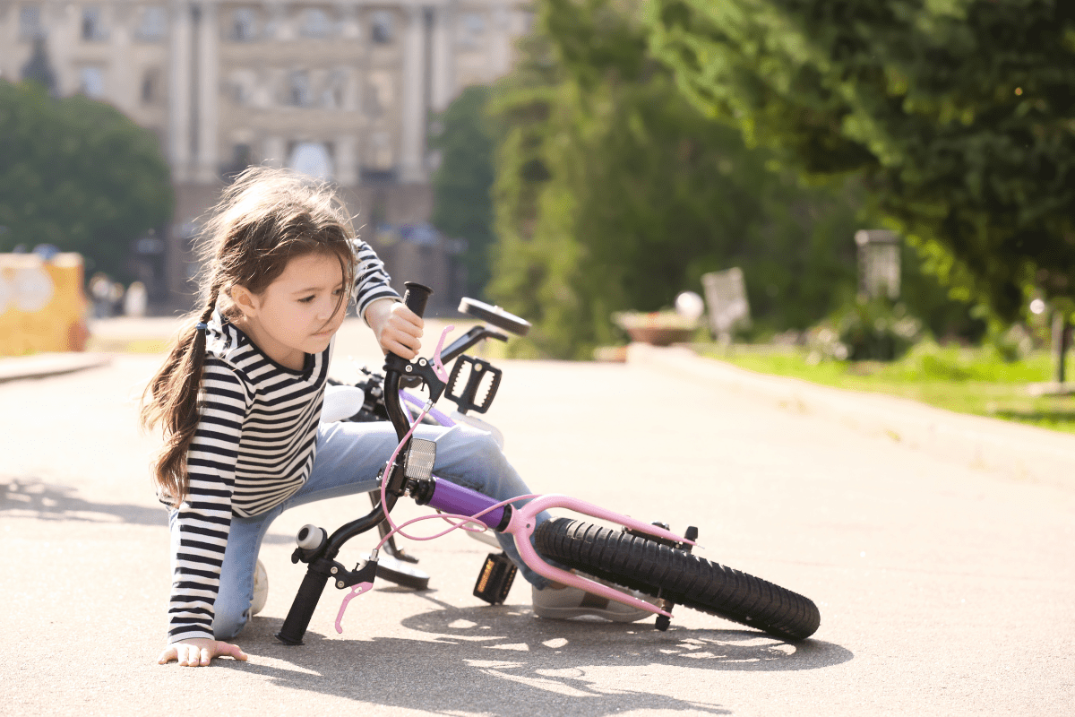 Girl learning to ride her bike using the 3 paths to integration